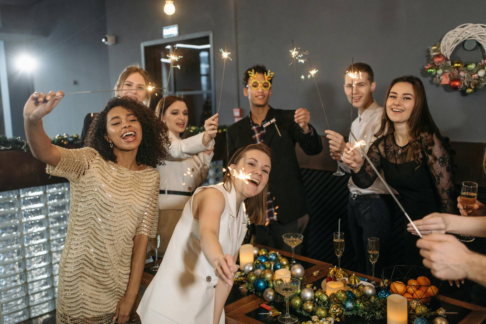 A person in a festive dress smiling at a party with text "KISS" - Great Instagram post idea for marketing campaign.